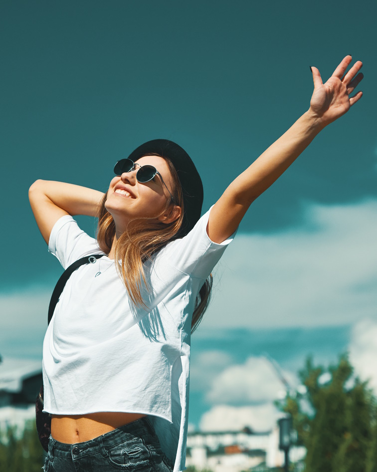 Woman celebrates with her hand outstretched