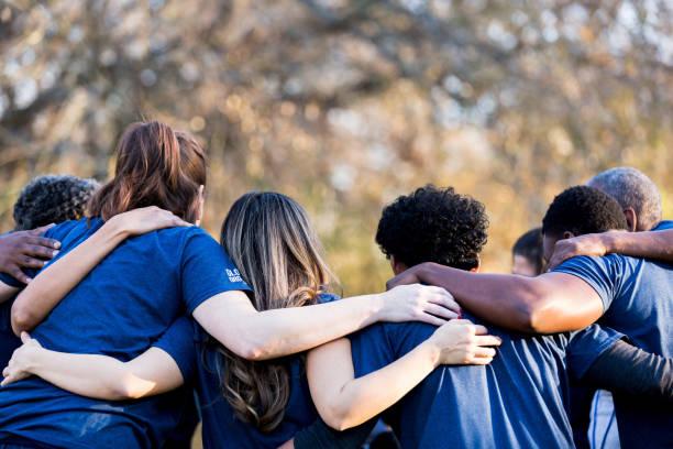 Children holding each other's shoulders